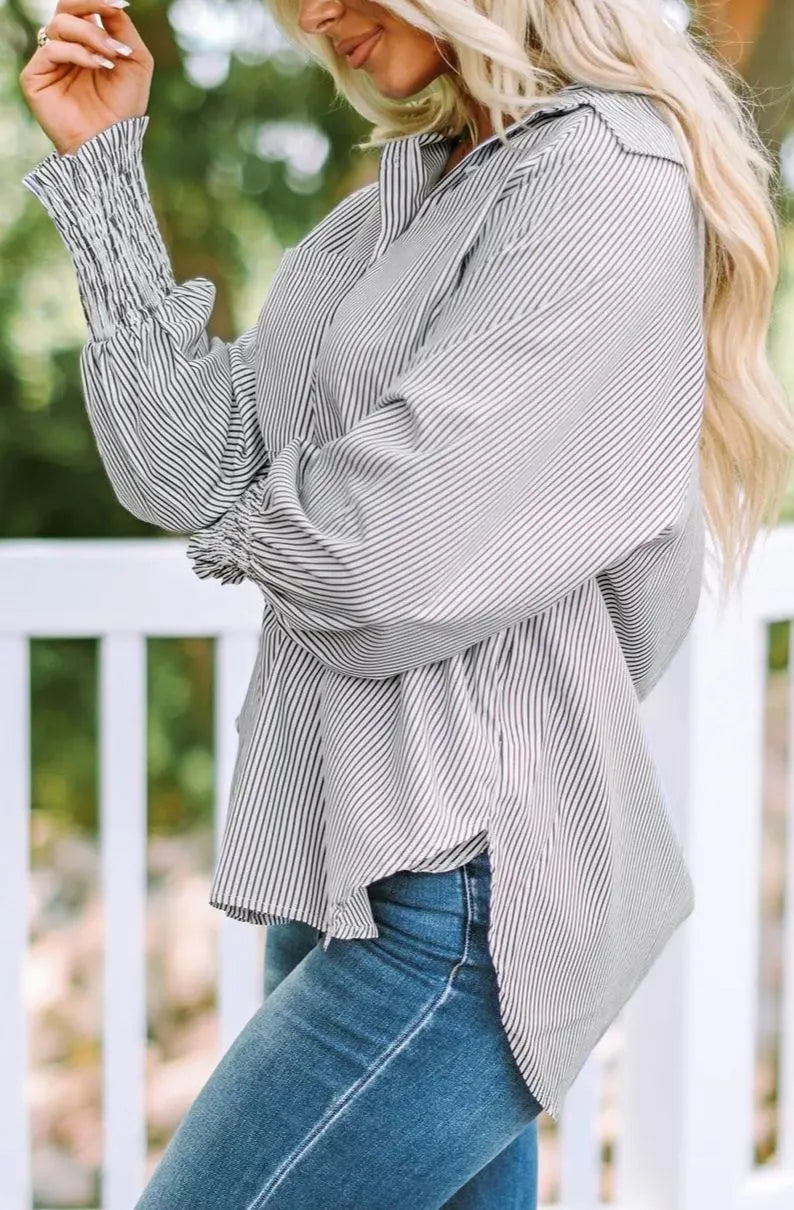 Mid-length shirt with striped lapel and oversized drawdown sleeves