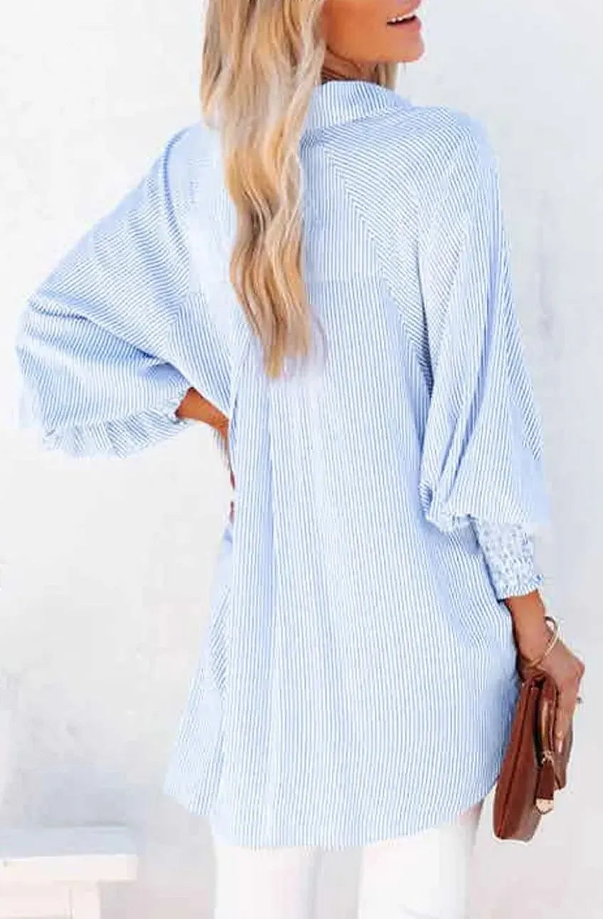 Mid-length shirt with striped lapel and oversized drawdown sleeves