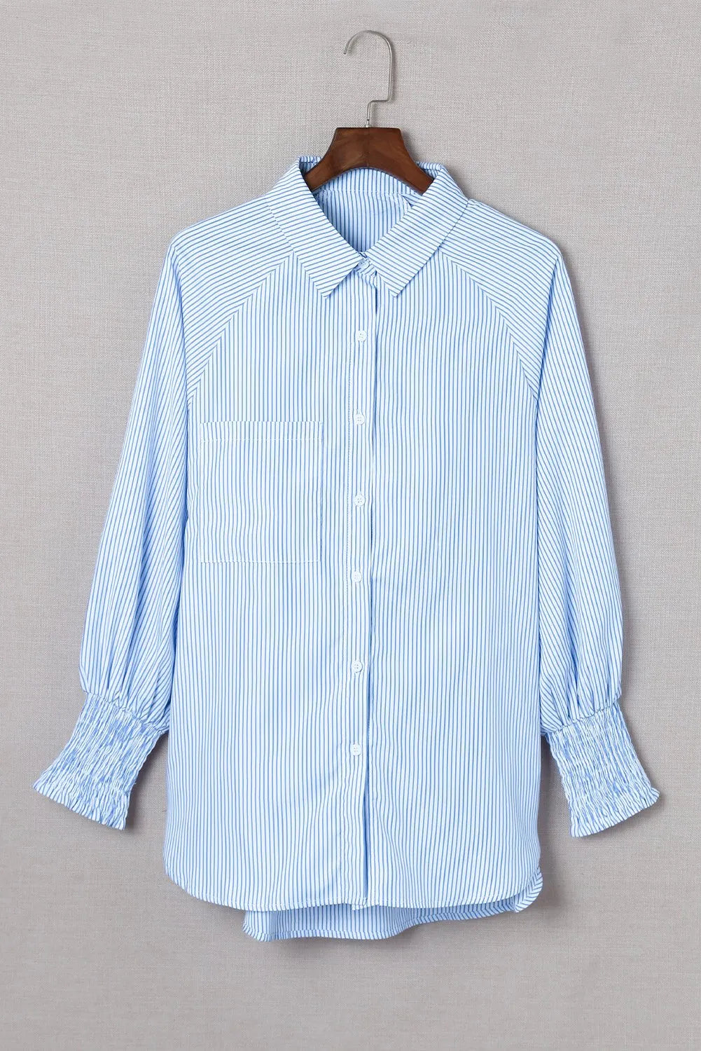 Mid-length shirt with striped lapel and oversized drawdown sleeves